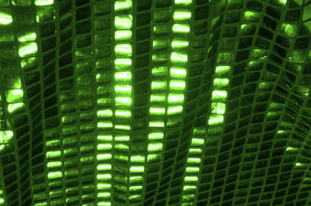 texture, background, pattern. Fabric with large paillettes made of green. Create a sharp look that is ready for attention with these multicolored oil stains of big sparkles.の写真素材