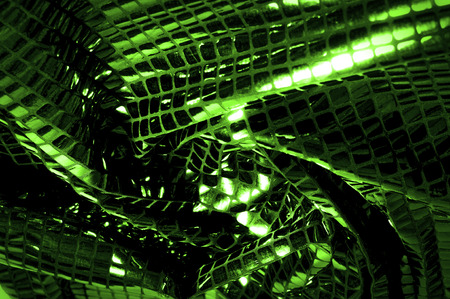 texture, background, pattern. Fabric with large paillettes made of green. Create a sharp look that is ready for attention with these multicolored oil stains of big sparkles.の写真素材