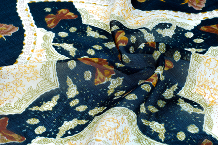 texture, background, pattern. Black silk handkerchief. With white stripes. On the stripes painted butterflies, floral patternの写真素材