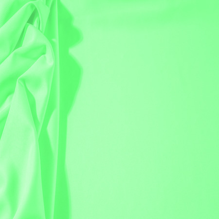 Texture. Background. Template. Cloth - silk green. Known extravagance, this Green silk taffeta is nothing more than a word. Luminous light green fabric is a crispy hand, inherent in tafeta.の写真素材