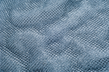 fabric, background texture. White silver mesh fabric, with a woven metallic thread. Silver fashion...