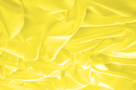 Soft focus. texture, pattern. fabric silky yellow, solar Golden yellow silk feil. Like the body to the taffeta, it has a smooth arm that creates a subtle sheen. Thin and lighter weight,の写真素材