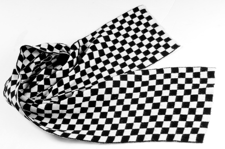 Texture, background, pattern. Scarf shawl tippet plaid white and black cell. a woman's long scarf or...