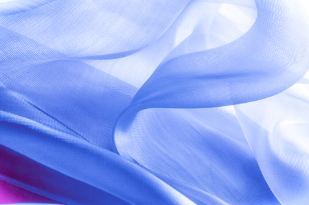 Texture, background, pattern. Blue silk fabric. Abstract background luxury blue fabric or liquid wave or wavy grunge texture.  Whole background.の写真素材