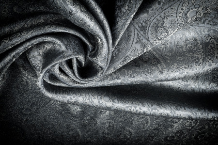 Background texture, pattern. Gray Paisley Silk Jacquard is an intricately woven shiny fabric with a tonal design woven in. The weave creates the effect of a 'shadow' pattern or print.の写真素材
