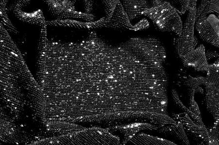 Black fabric with paillettes Make a dazzling debut  this Black Baby Sequined  The coating of the strength of the continuous mesh remains a dense arrangement of circular glitters for the entire coatingの写真素材