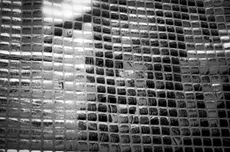 texture, background, pattern. Fabric with large paillettes of gray black. Like a binding paint mixed with a mirror effect, these gray reflective pale glitters are truly unique.の写真素材