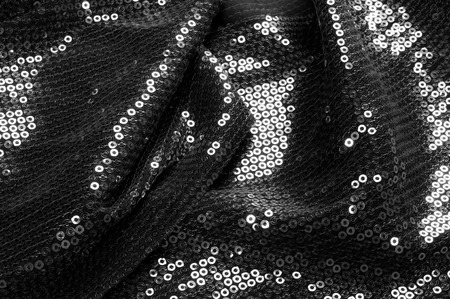  texture Fabric black with paillettes This shine, which you are guaranteed to like this material has a circular matte sequins hanging along the light georgette, creating a soundtrack with each movementの写真素材