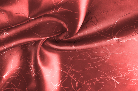 Background texture, pattern. Silk fabric is red with a pattern. Add an exotic flash to your look with this Persian red abstract printed font SIlk Charmeuse. Bold in warm colorsの写真素材