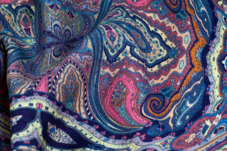 Background texture, pattern. paisley fabric of blue color with a floral pattern. Presenting a...