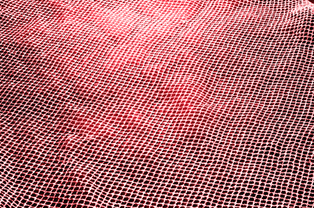 red silver mesh fabric, with a woven metallic thread Celebrate sports aesthetics with this silver red novelty With a similar body and weight it falls on some volume adding geometric texture and designの写真素材