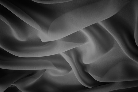 silk fabric is transparent, black and white. this material contains a coarser texture, a more rigid drapery and a slight peeping effect. We recommend using this fabric for your convenience.の写真素材