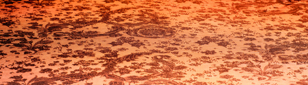 macro texture of brown striped fabric studio. Artistic fabric texture, folded, wavy. dark red silk...