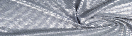 Silk fabric texture, background. Covered with sequins, silver colorの写真素材