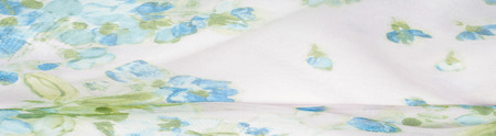 Silk fabric texture, background, painted white with blue flowers