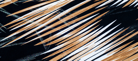 texture of silk fabric. background. Yellow brown white stripes line. On a black background. Brilliant line.の写真素材