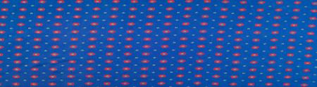 texture of the silk fabric with an abstract pattern, a pattern of tiny red quadrangles. 