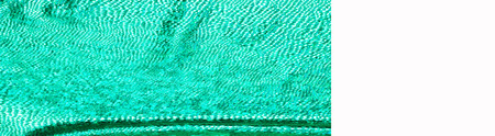 texture of silk fabric; background. green skin of the snake. shiny fabric