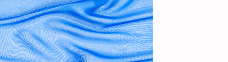 fabric silk texture. background. blue color. a fine, strong, soft, lustrous fiber produced by silkworms in making cocoons and collected to make thread and fabric.の写真素材