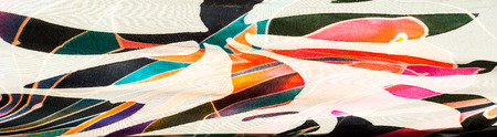 Fabric silk texture. abstract painting. bstract wave pattern on silk batik. a fine, strong, soft, lustrous fiber produced by silkworms in making cocoons and collected to make thread の写真素材