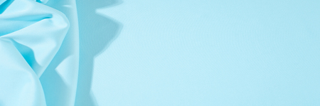 Texture. Background. Template. Pamper your design with a luxurious light blue silk flag. The blue dip can boast of a dull sheen and a crisp hand. His stiff drape creates volume when he falls.の写真素材