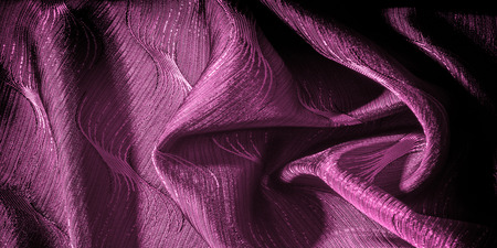 Texture, background, pattern. silk cloth red color. Iridescent with a more rigid drapery, this organza trim is simply beautiful when it catches light. Its pebbled texture adds a bit bit.の写真素材