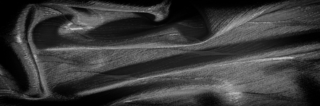 Texture, background, pattern. silk fabric with a pattern. black color. As dark as night and as...