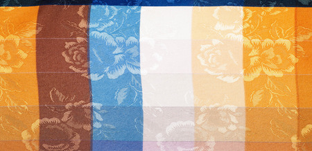 fabric texture silk. background. Vertical lines. Blue red brown yellow white stripe. embroidered...