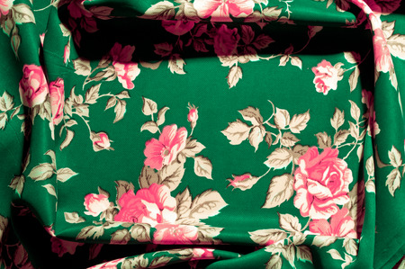 Background, texture, pattern. green fabric with painted rose flowers, Fine and gentle to the touch...