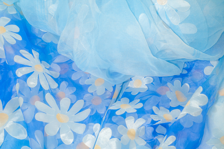 Texture, background, pattern. Tulle blue with chamomile flowers. This design is available on the fabric of your choice, for purchase in the yard. -or- in the bold quarterの写真素材