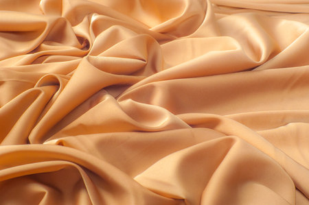 Texture pattern. The color of coffee with milk is a silk fabric. Milk silk is the term given to silk, which is derived from milk. fabric with a rich velvety texture and feels very luxurious In designの写真素材