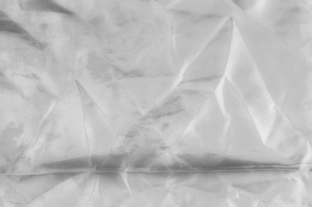Soft focus texture white silk fabric. Look absolutely perfectly in this Silk and Cotton Dual Satin....