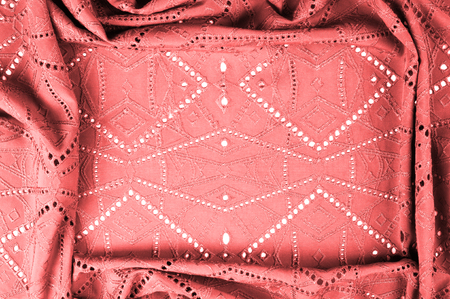 texture, pattern. Cloth red dense with perforated holes. Stop your search for perforated perfection...