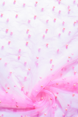 Pink translucent fabric embroidered with beads. Get a red carpet with this lace lace of beads Couture! Luminous beads, sequins and rhinestones are woven throughout the fine gridの写真素材