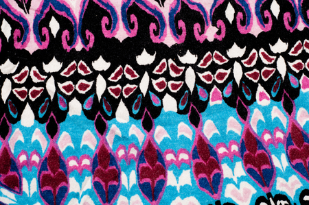 Texture, background. fabric knitted. blue red black pattern. teal green blue, taupe brown, and black on a light weight cotton spandex rayon blend knit. Fabric is soft with a nice drape and stretchの写真素材