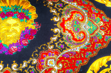 Background texture, drawing. Silk fabric. Fabric with bright patterns of yellow and red colors,...
