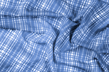 background texture. silk fabric checkered blue white Soft with a fine texture, this perfectly flowing fabric has an excellent drapery Thin, light and slightly translucent with the addition of elastaneの写真素材
