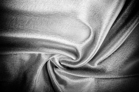 texture, pattern. Fabric made of silk fabric is black, This metallic black abstract jacquard is as magical as a mermaid under the water. The luminous metallic shade is mixed with the spray of colorの写真素材