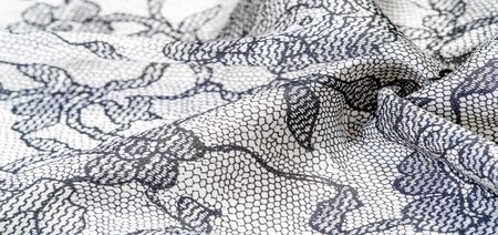 texture, background, pattern. Silk white fabric with lace patterns. This elastic lace trim can add a...
