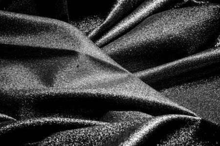 Texture, background, pattern. Cloth Gray black coated with a metallic silver thread. These fabrics...