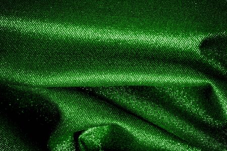 Texture, background, pattern. The fabric is Dark green coated with a metallic silver thread. These fabrics are ideal for any project, wallpaper, all design solutions. and many uses of shipsの写真素材
