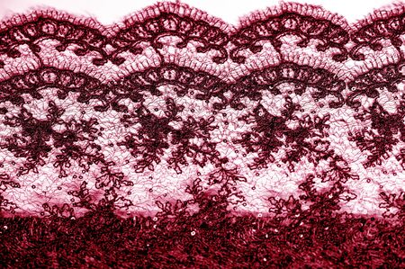 Texture, pattern, lace fabric in red on a white background. Delicate and classic, this sheer lace has no significant stretch and pearlescent shine. Suitable for your design wallpapers and postersの写真素材
