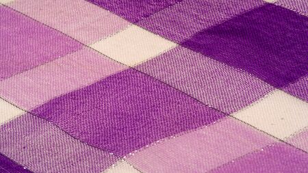 Texture background pattern silk scarf female blue in color with a metal stripe. The scarf is decorated with a delicate patchwork pattern in pastel shades of abstract Scotlandor motifs checked fabricの写真素材