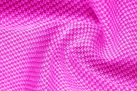Background texture, pattern Fabric warm wool with a stitched red thread. This one makes us want to curl a fireplace with a mug of hot chocolate. His ultra-soft and fuzzy hand is an open knit designの写真素材