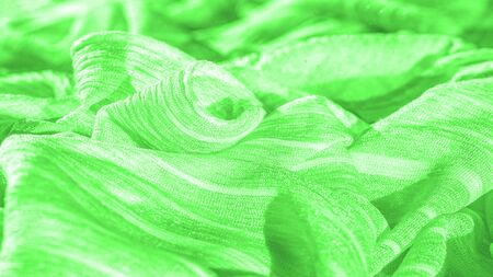 Texture, background, pattern, collection, wrinkled silk fabric "electric" green. 3D pleated wrinkled and wrinkled light camel fabric made of pure silkの写真素材