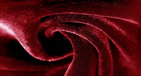 Texture background, pattern. red velveteen. Rock the runway with this beautiful high fashion fabric. This medium weight fabric has a beautiful shine with a velvet face for a feeling of luxury.の写真素材