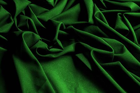 Textured, background, pattern, green fabric. Alpine upholstery Velvet hunter Green patio.の写真素材
