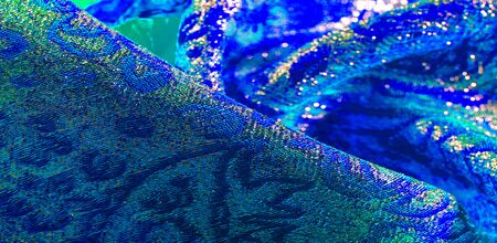 Texture background, pattern. blue brocade fabric. Organza brocade fabric - shepherd, with a crunchy...