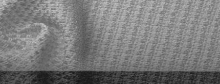 Background texture, pattern. White fabric with metallic sequins, Swivel heads with this two-tone...