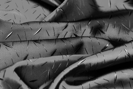 textured, background, drawing, Black silk fabric, Silk fabric Dupioni has a shiny luster and characteristic small blinds that pass horizontally across the fabric.の写真素材
